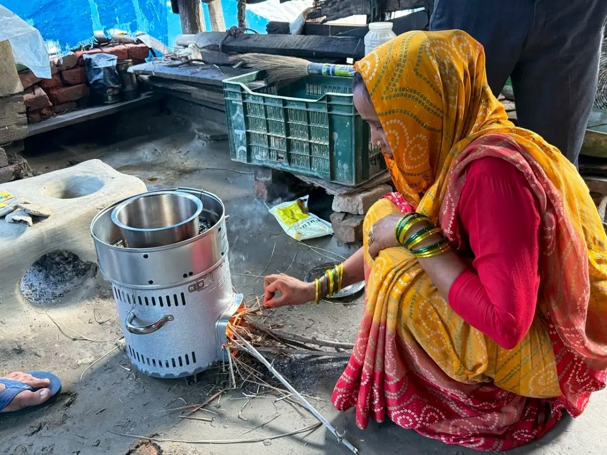 A participant using an improved cookstove at home