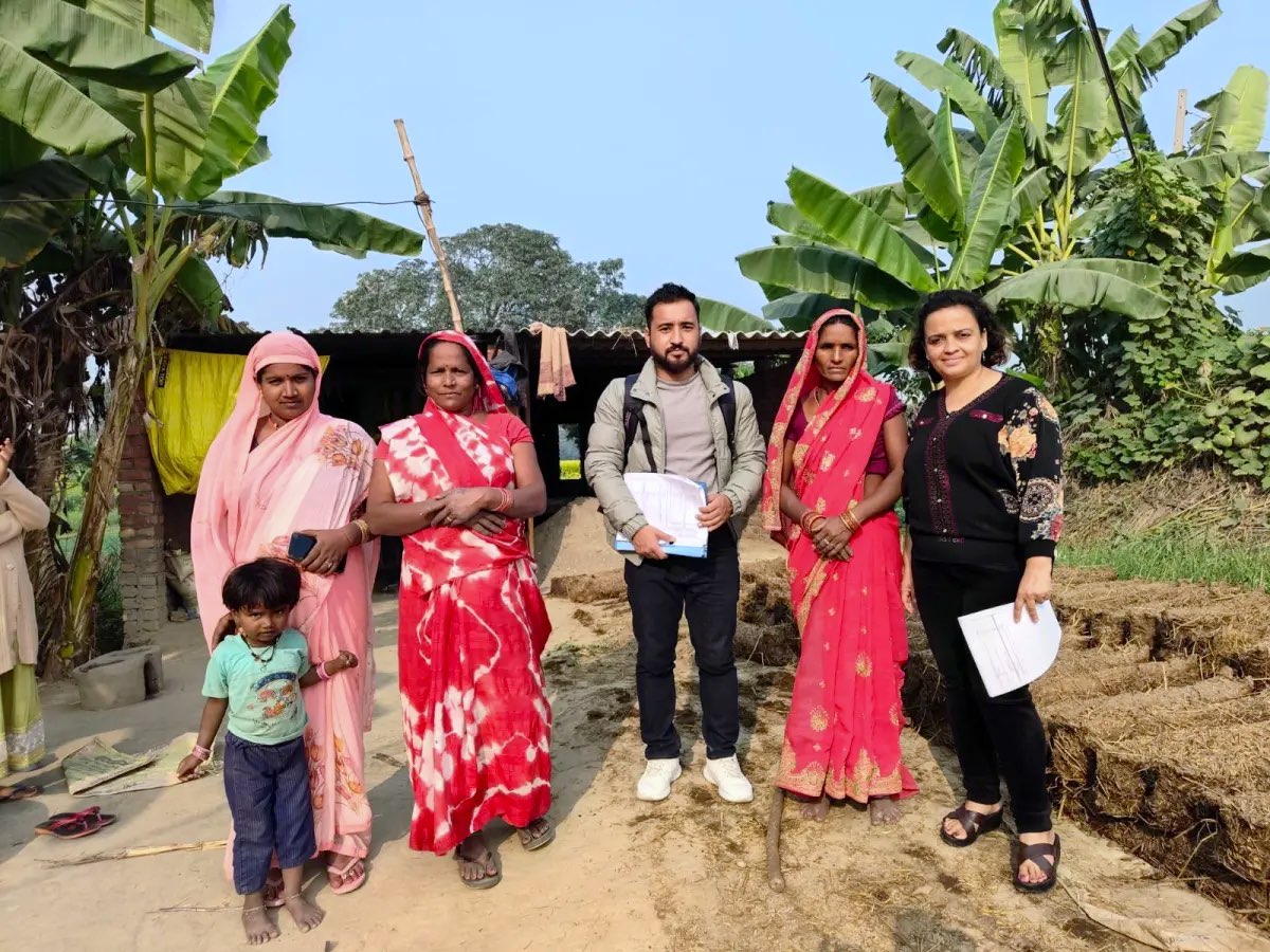 Community members with the programme field team